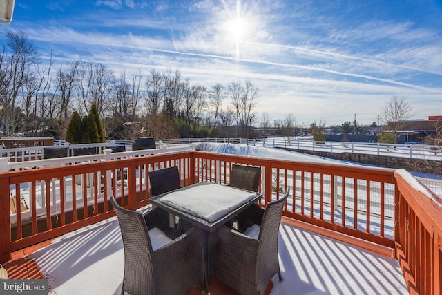 view of snow covered deck