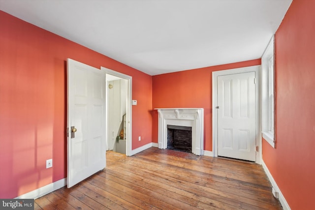 unfurnished living room featuring hardwood / wood-style floors