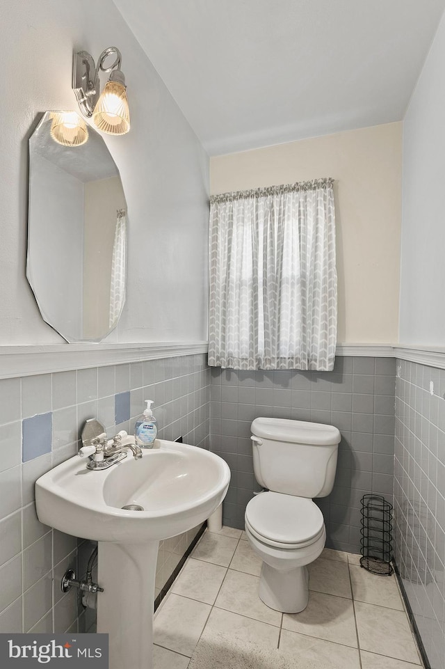 bathroom with tile patterned flooring and toilet