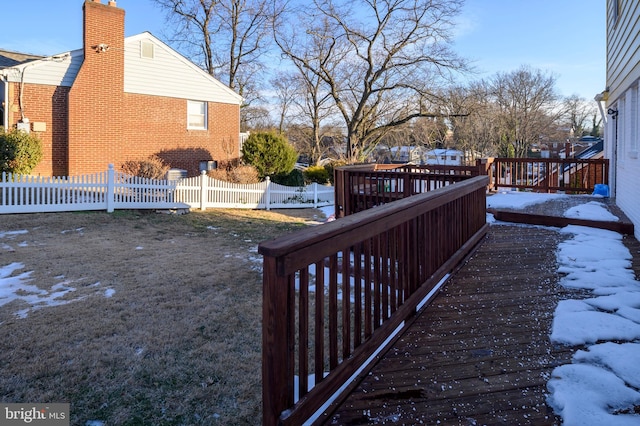 view of snow covered exterior featuring a wooden deck