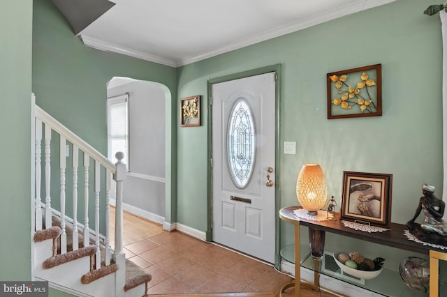 tiled entrance foyer with crown molding