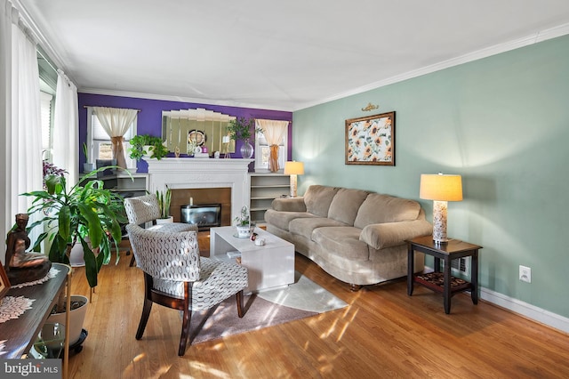 living room featuring hardwood / wood-style flooring and ornamental molding