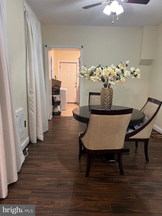 dining room featuring dark wood-type flooring and ceiling fan