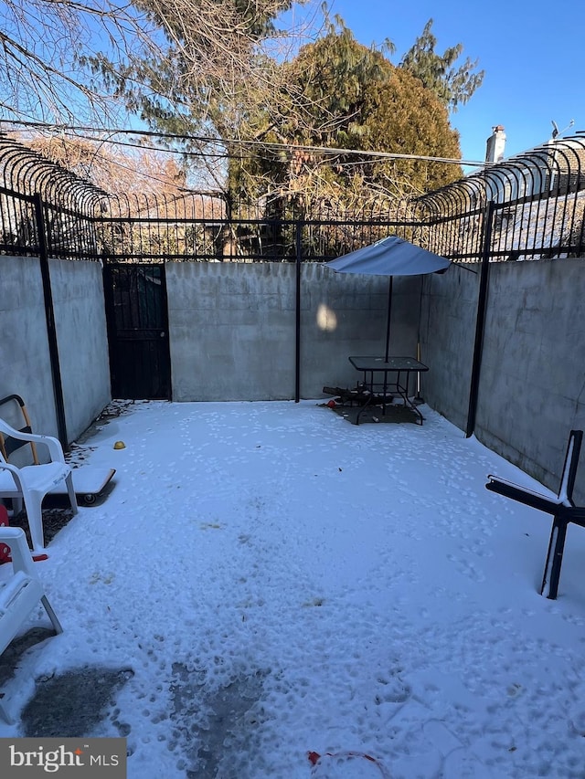 view of yard layered in snow