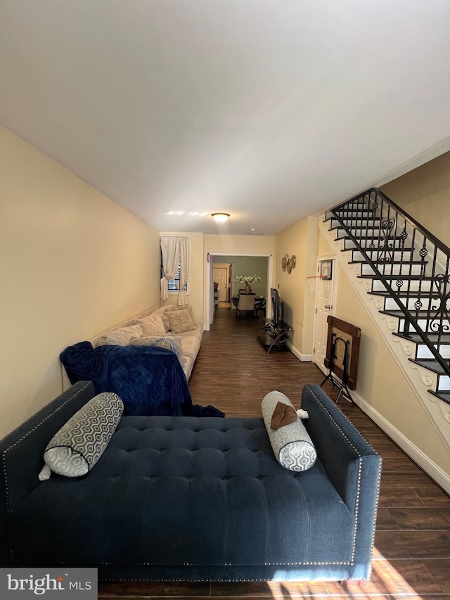 living room with dark hardwood / wood-style flooring