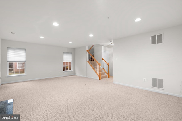 interior space with stairway, visible vents, and a healthy amount of sunlight