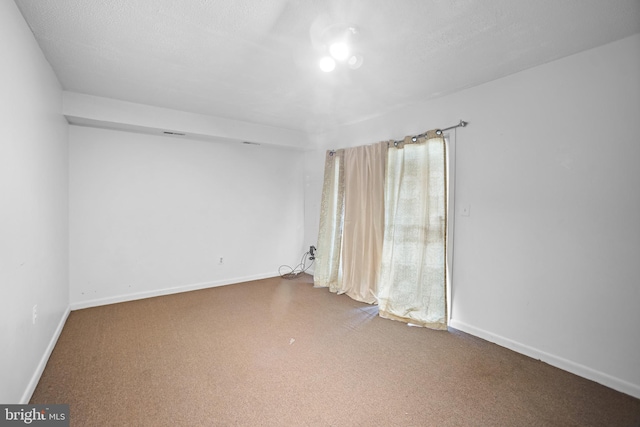 empty room with a textured ceiling