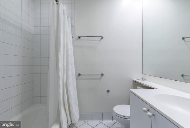 bathroom with shower / tub combo, vanity, toilet, and tile patterned floors