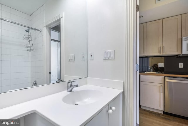 full bathroom with walk in shower, wood finished floors, and vanity