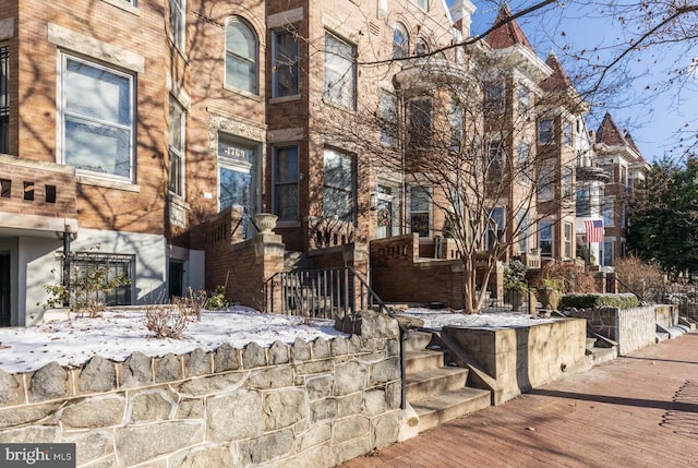 exterior space featuring brick siding