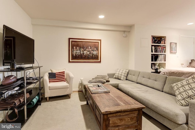 living area featuring built in features, recessed lighting, and light carpet