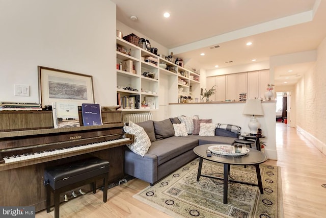 living room featuring light wood-style floors and recessed lighting