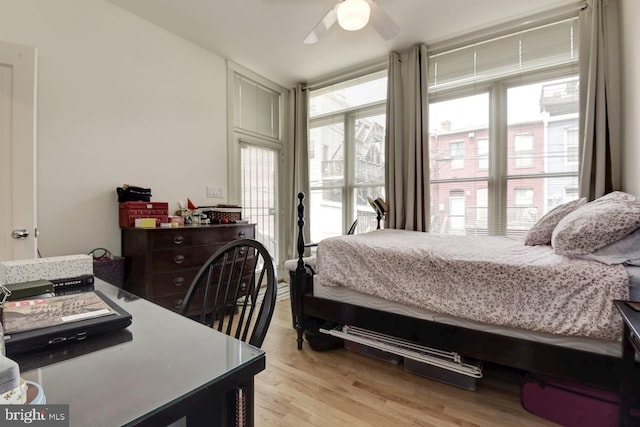 bedroom featuring ceiling fan and light wood-style flooring