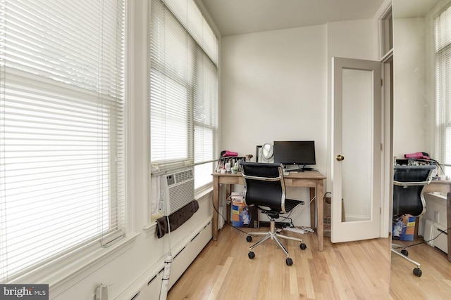 office space with cooling unit and light wood-style flooring