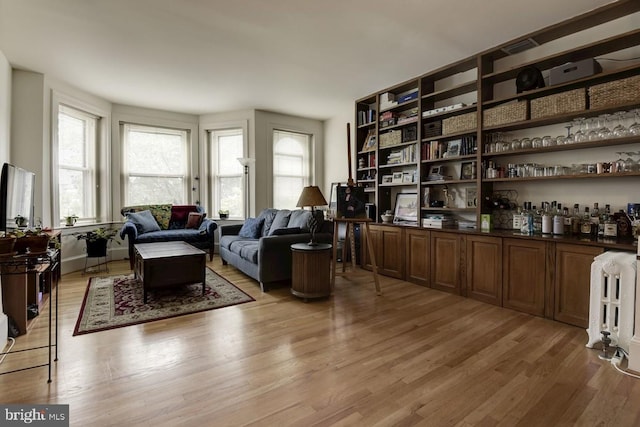 sitting room with light wood-style floors