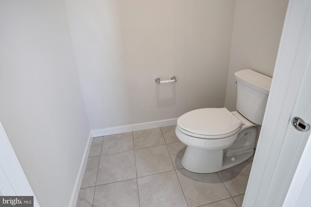 bathroom featuring tile patterned flooring and toilet