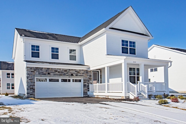 view of front of home with a garage and covered porch