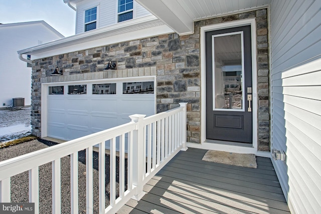 doorway to property with a garage