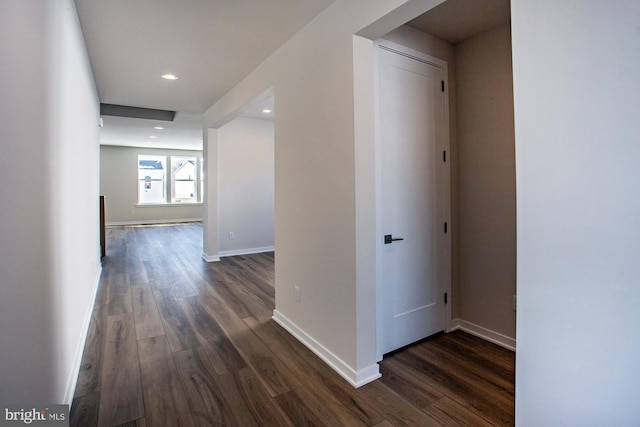 corridor featuring dark wood-type flooring