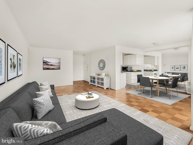 living room featuring light parquet flooring