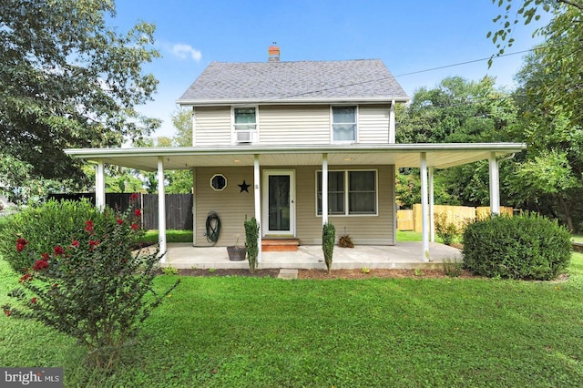 farmhouse inspired home with a front yard