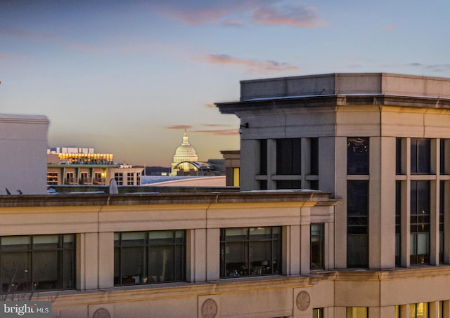 view of outdoor building at dusk