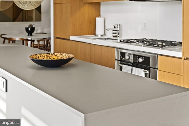 kitchen featuring appliances with stainless steel finishes and sink