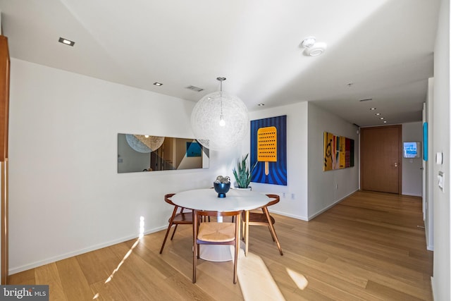 dining area featuring wood-type flooring