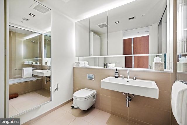 bathroom featuring tile patterned floors, toilet, and sink