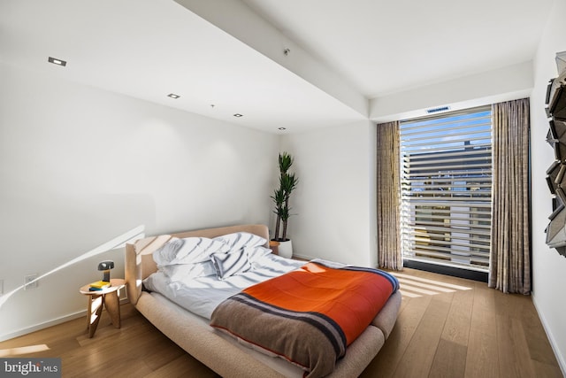 bedroom with wood-type flooring