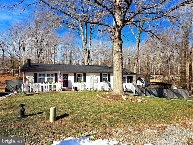 ranch-style home with a front lawn