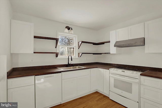 kitchen featuring extractor fan, sink, white cabinets, and white appliances