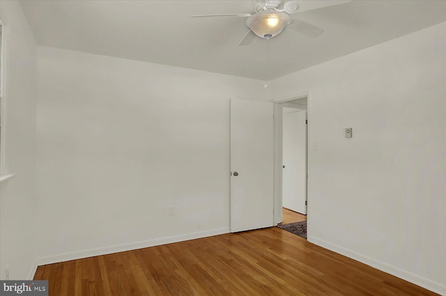 unfurnished room featuring ceiling fan and light wood-type flooring