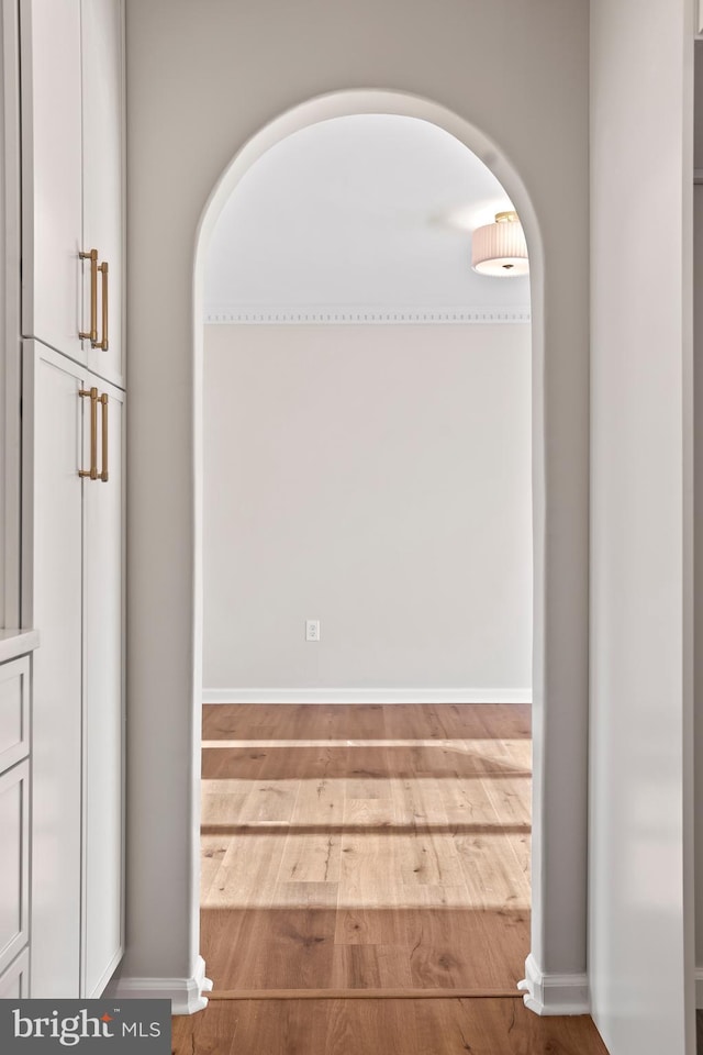 hallway with light hardwood / wood-style flooring