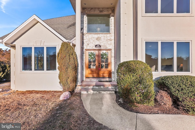 property entrance featuring french doors