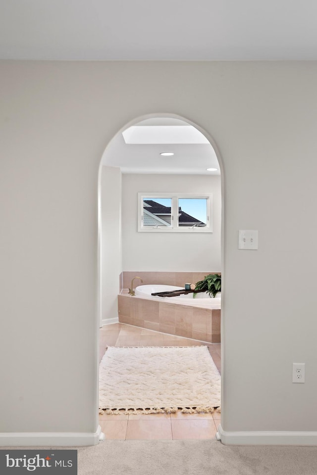 bathroom with tile patterned floors