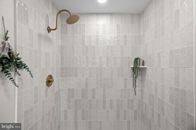 bathroom with tiled shower