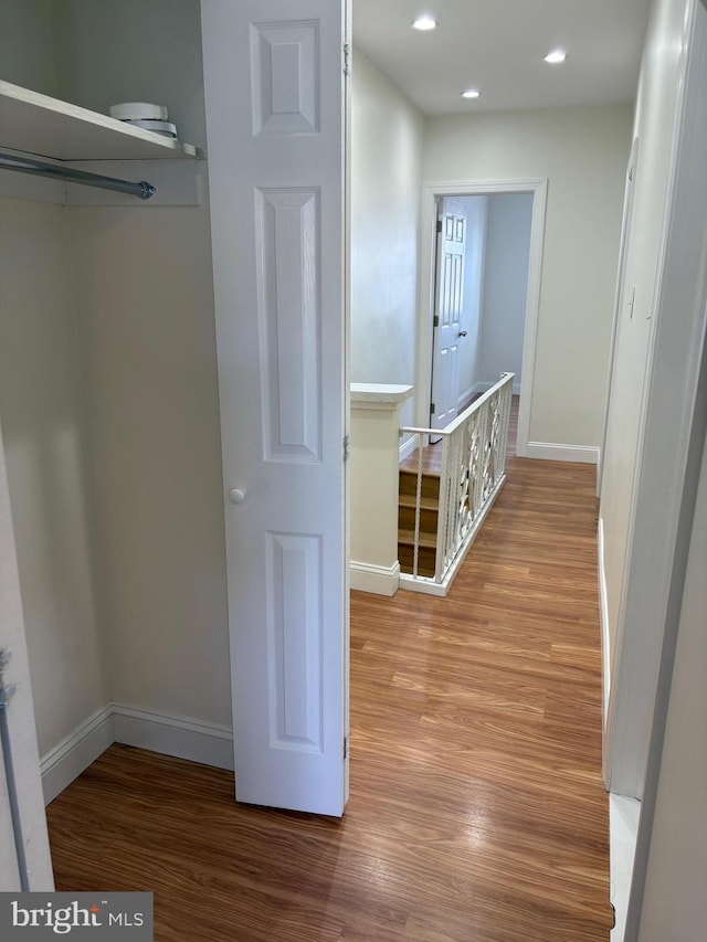 hallway featuring hardwood / wood-style flooring