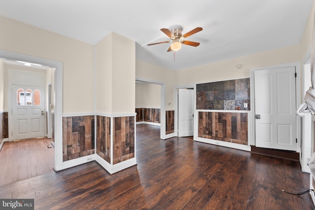 unfurnished room with ceiling fan and dark hardwood / wood-style floors