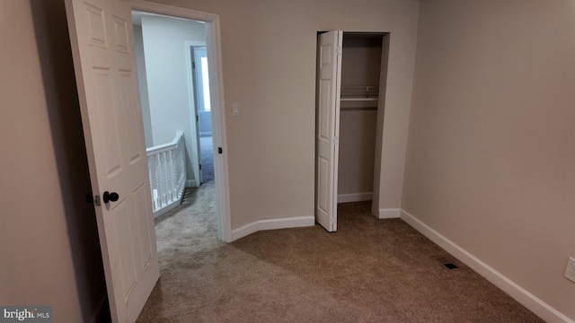 unfurnished bedroom with light carpet