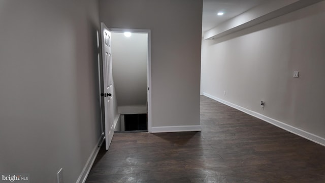 spare room featuring dark hardwood / wood-style flooring