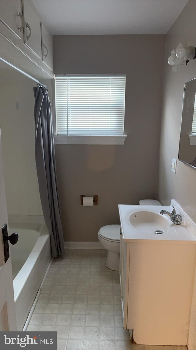 full bathroom featuring vanity, shower / bath combination with curtain, and toilet