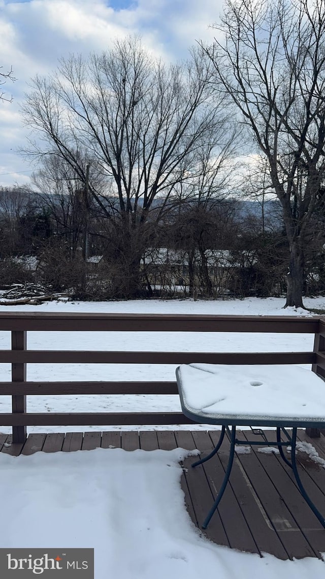 view of snow covered deck