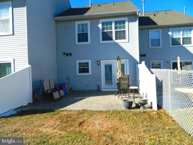 back of house featuring a yard and a patio