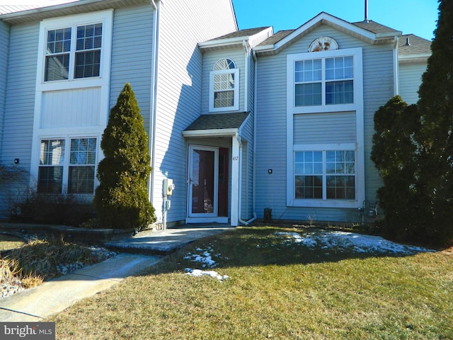 front facade with a front lawn