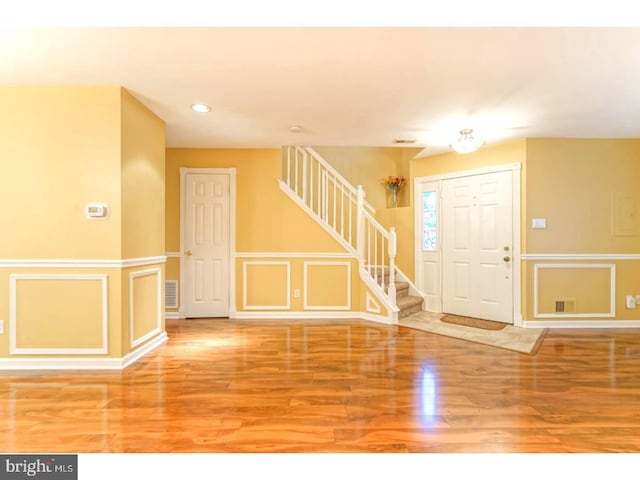 entryway with hardwood / wood-style floors