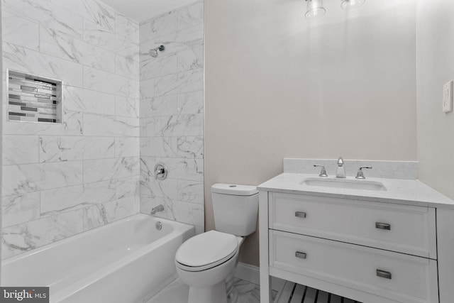 full bathroom featuring vanity, tiled shower / bath, and toilet