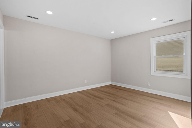 spare room with light hardwood / wood-style floors