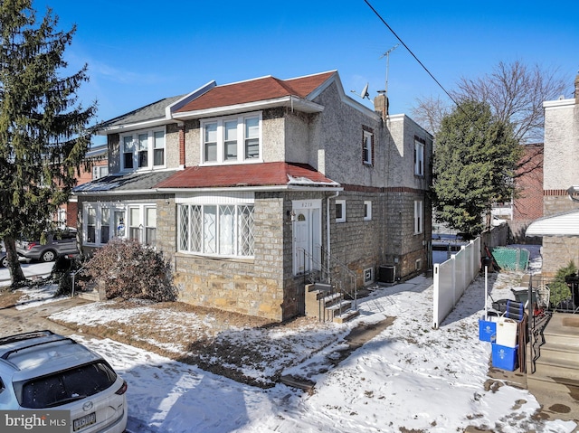 view of front of property featuring central AC unit