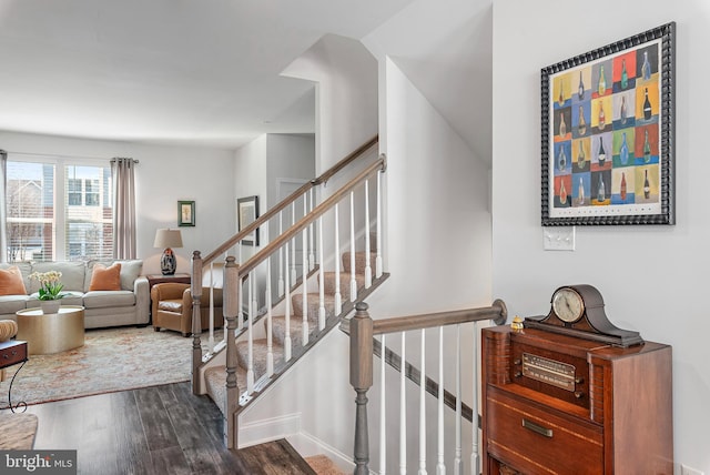 stairs with hardwood / wood-style flooring